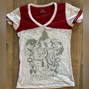 Gryffindor tee shirt size large. White is mottled. Fits on snugger size.